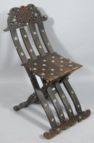 A Syrian hardwood folding chair