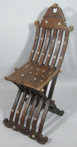 A Syrian hardwood folding chair