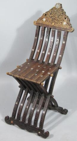 A Syrian hardwood folding chair