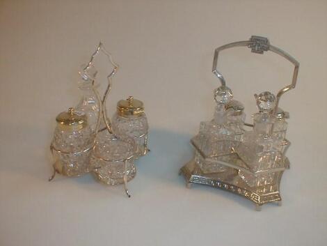 Two silver plated cruet stands with crystal bottles