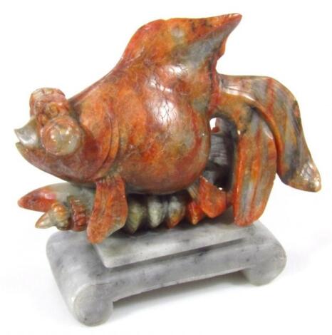 A 20thC tri-coloured soapstone figure of a fish