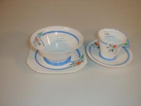 A Shelley china Mode trio painted with flower and berry spray and geometric
