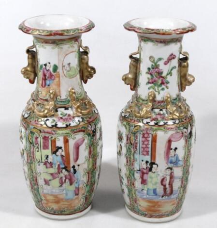 A pair of late 19thC Chinese Canton two handled decorated vases