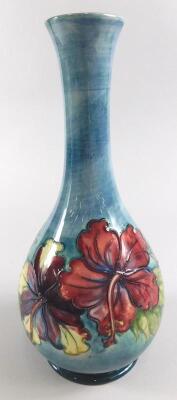 A Moorcroft floral pattern bottle shaped vase