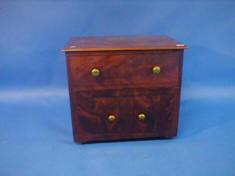 A 19thC flamed mahogany commode