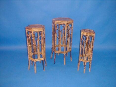 A bamboo nest of three graduated jardiniere stands