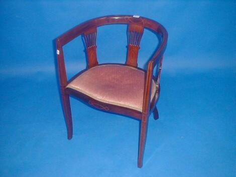 An Edwardian string inlaid mahogany tub chair