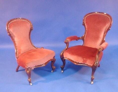 A Victorian carved walnut spoon back open armchair and nursing chair on scroll legs