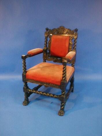 A 19thC oak hall chair with barley twist and acanthus carving