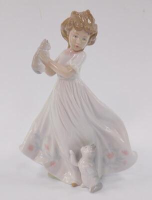 A Lladro porcelain figure of a girl with kittens