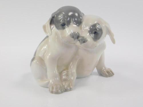 A Royal Copenhagen porcelain figure group of Pointer puppies