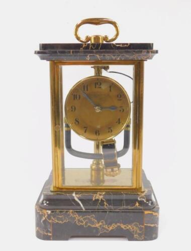 A Bulle Clockette brass and veined black marble electric mantel clock