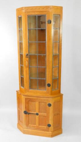 A 1979 Robert 'Mouseman' Thompson light oak corner cabinet