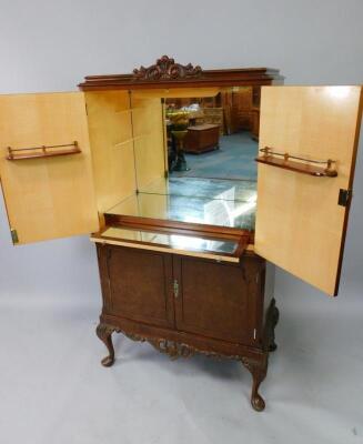 A mid 20thC burr walnut cocktail cabinet - 2