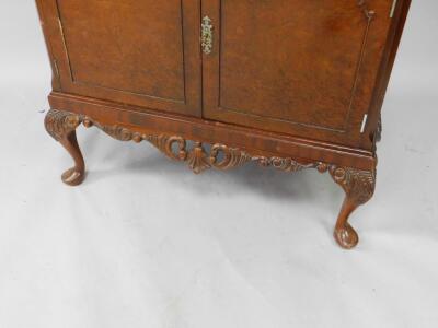 A mid 20thC burr walnut cocktail cabinet - 3