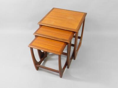 A nest of G-Plan teak cross banded occasional tables