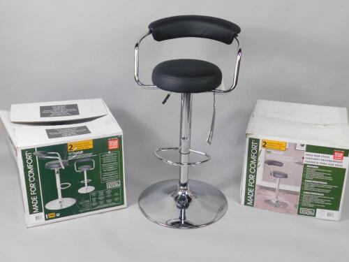 Four chrome and Puresoft leatherette bar stools