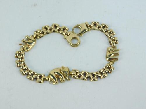 A 9ct gold bracelet set with elephants at intervals