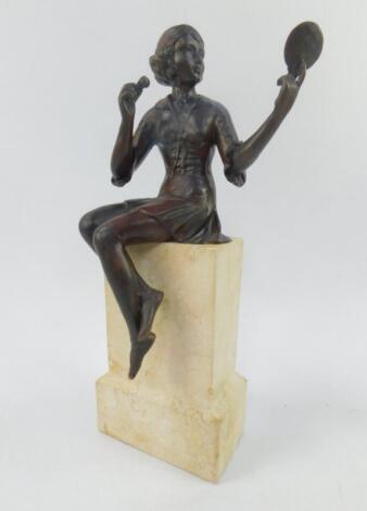 An Art Deco style bronze figure of a seated girl