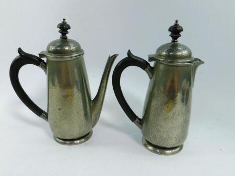 A Liberty & Co Archibald Knox design pewter coffee pot and hot water jug