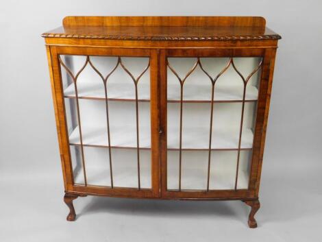 An early 20thC mahogany bow front display cabinet