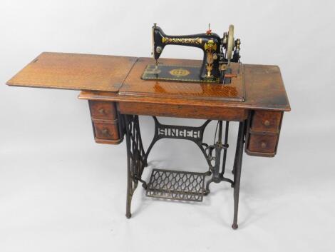 A Singer treadle sewing machine on an iron base