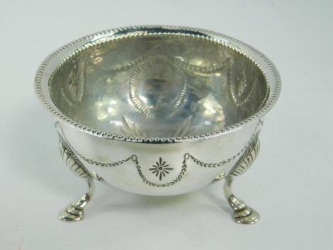 An Edward VII silver bowl with engraved decoration