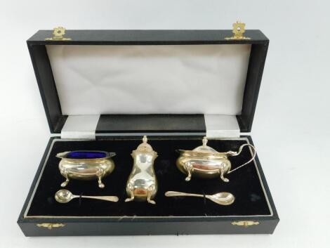 A silver three piece condiment set