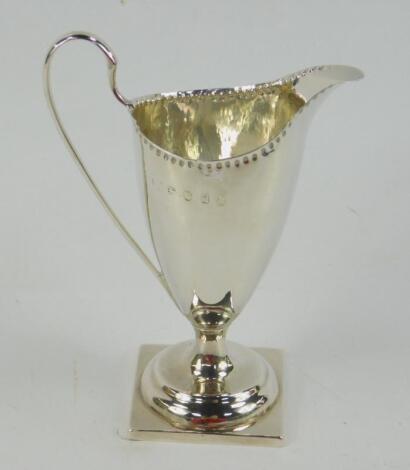 A George III Adam style silver cream jug