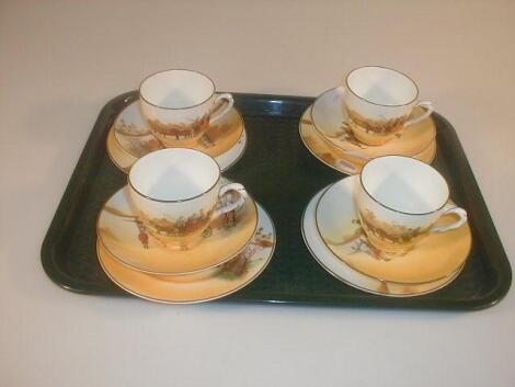 A Royal Doulton Coaching Days part tea set comprising four cups saucers