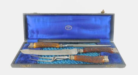 A Victorian horn and steel three piece carving set