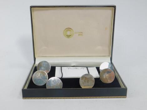 A set of six silver place card holders