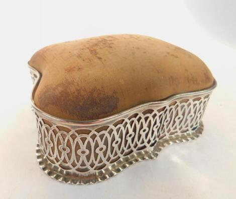 An Edward VII pierced silver framed pin cushion