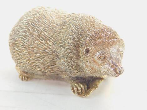 A silver figure modelled as a mole