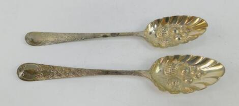 A pair of George III silver berry spoons