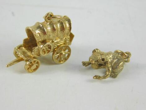 Two 9ct gold charms modelled as an American wagon and a frog