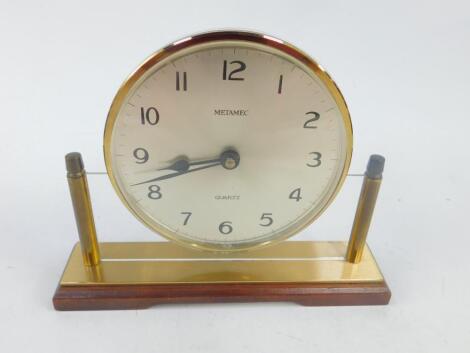 A Metamec quartz floating mantel clock