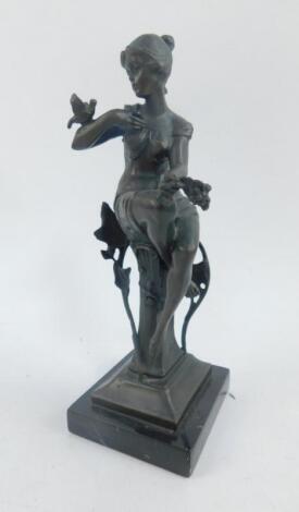 An Art Nouveau style bronze figure of a woman