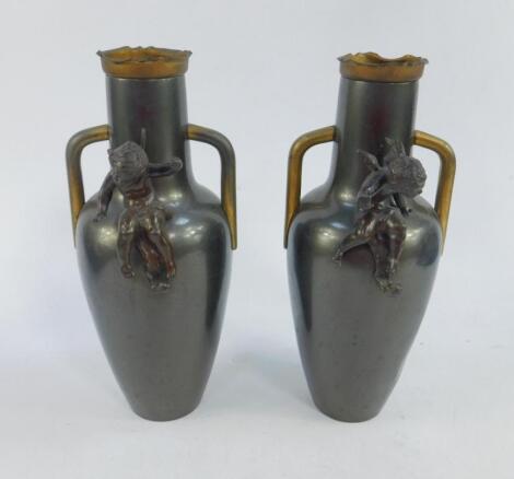 A pair of Continental late 19thC twin handled metal garniture vases