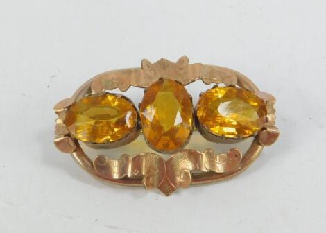 A Victorian three stone citrine brooch