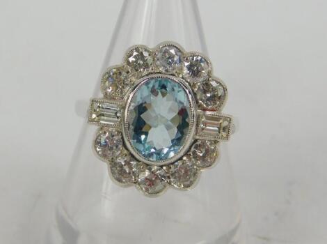 An aquamarine and diamond ring