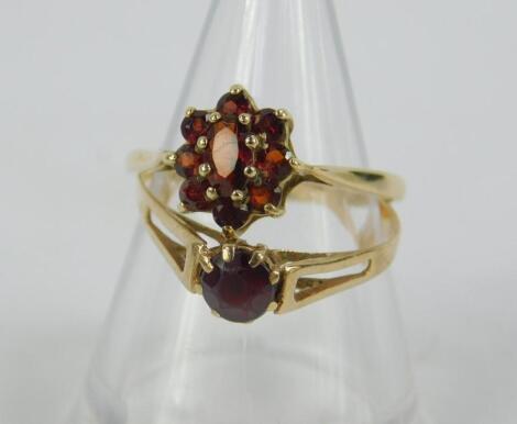 Two 9ct gold and garnet set rings