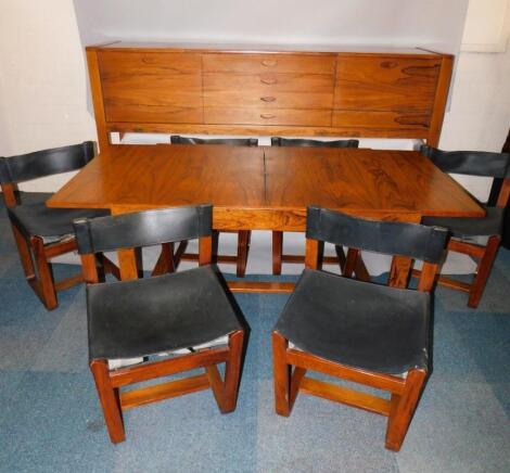 A Uniplex 1960's rosewood dining suite designed by Gunter Hoffstead