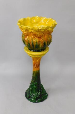 A Bretby late 19thC pottery jardiniere on stand