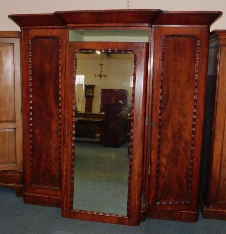 A Victorian mahogany break front compactum wardrobe