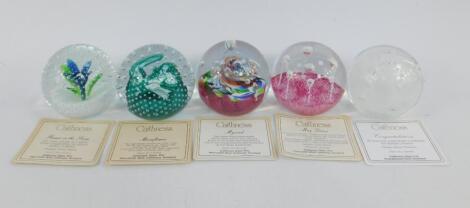 Four Caithness glass paperweights