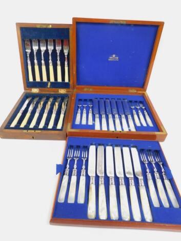 A set of twelve plated fruit knives and forks