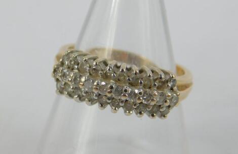 A 14ct gold and diamond three row ring