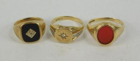 Three gentleman's 9ct gold and gem set signet rings