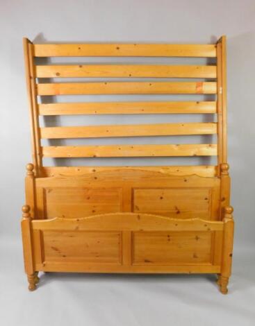 A pine framed double bed